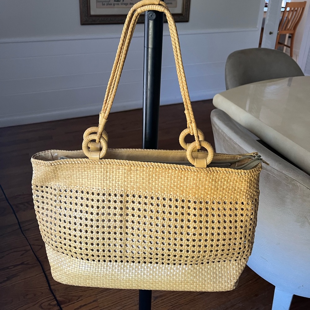 RENEE’s mustard color tote handbag. Easily worn over shoulder. No signs of wear.